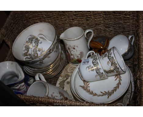 A Victorian gilded leaf pattern part Teaset including five cups, ten saucers, two cake plates and a slop bowl together with t