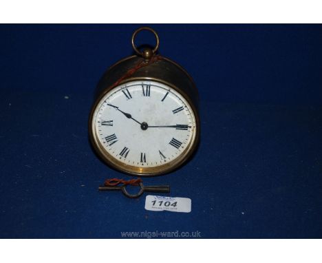 A circa 1850 circular Brass Mantle Clock with cylindrical brass case, white Roman numeral face, double ended key, marked insi