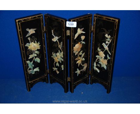 A miniature oriental lacquered four fold Screen with Mother of Pearl bird and floral motifs, 4'' wide (closed) x 14 1/4'' hig