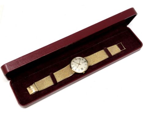 A gent's 9ct gold Omega Geneva calendar centre seconds wristwatch, circa 1970, brushed silver dial with baton numerals, date 