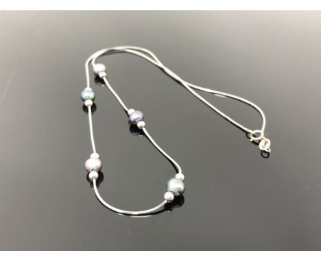 A 9ct white gold grey pearl necklace