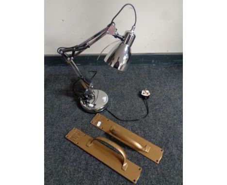A pair of early 20th century metal door handles together with a contemporary angle poise lamp  