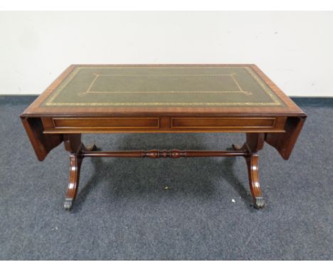 A mahogany flap sided sofa coffee table with a tooled green leather inset panel , 50 cm x 93 cm x 50 cm + extensions.