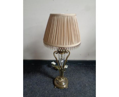 A decorative brass and cut glass table lamp with beaded shade 