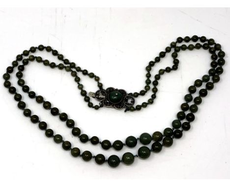 A double strand jade necklace on silver clasp 