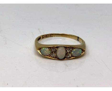 An antique 18ct gold opal and diamond ring, size Q.  CONDITION REPORT: 3.5g