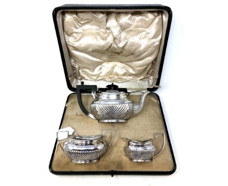 A silver three piece bachelor's tea service, James Dixon and Son, Sheffield 1894, 644.3g, boxed. CONDITION REPORT: This is in