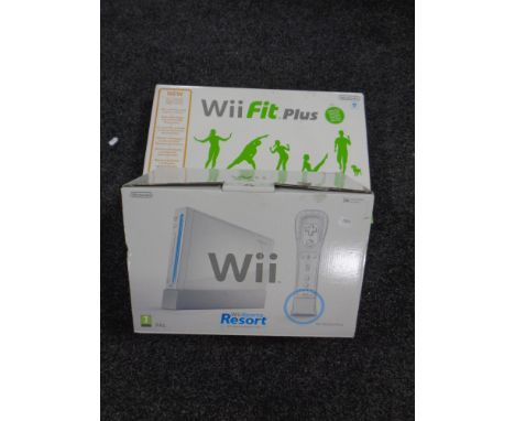 A Nintendo Wii Sports Resort console and game pack together with a Wii Fit +, boxed  