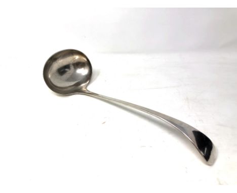 A large silver plated ladle 