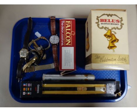 A tray containing miscellaneous to include a boxed Bell's Scotch Whisky decanter, sealed, a boxed Flacon pipe, a Donramos cig