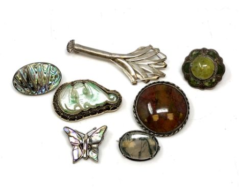 Silver brooches including Scottish, agate, jade, mother of pearl. 