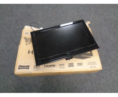 A Hitachi 26 inch LCD TV with lead and wall mounting bracket 