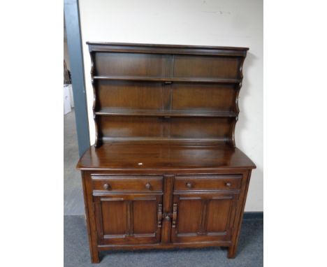 An Ercol elm and beech welsh dresser in an antique finish 