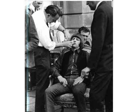 Three original vintage photographs of Ringo Starr on set of The Beatles Help! Film, all marked Keystone Press Agency Limited.