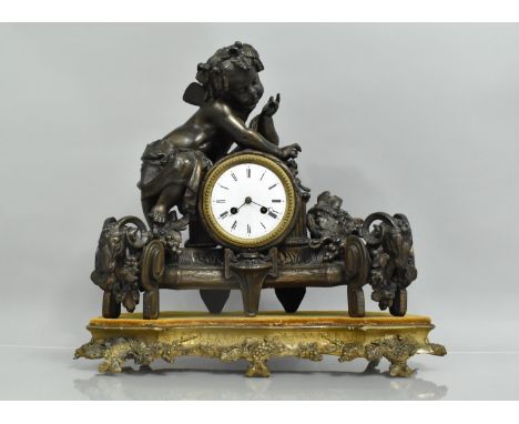 A Large French Bronzed Spelter Figural Mantel Clock in the Form of Cherub Seated and Leaning Over Barrel. Base with Rams Head