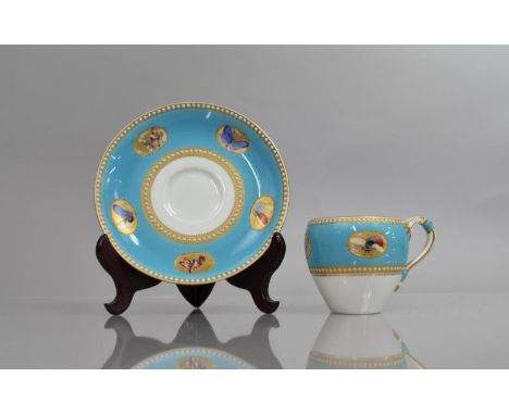 A Royal Worcester Cabinet Cup and Saucer, Hand Painted Cartouches of Butterflies on Blue Ground with Jewelled White and Gilt 