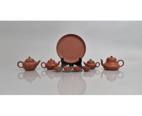 A Collection of Chinese Miniature Yixing Tea Wares to comprise Four Teapots, Four Teabowls and a Circular Tray, Various Ages,