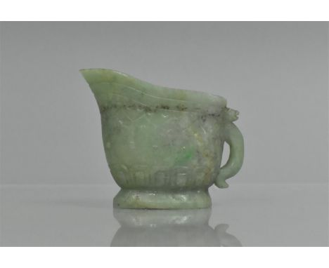A Chinese Jade Libation Cup with Spout Having Stylised Handle, 9cms by 7.5cms 