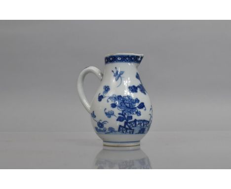 An 18th century Chinese Porcelain Sparrow Beak Lipped Blue and White Jug with Loop Handle, Decorated with Garden Scene, 10cms