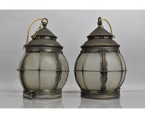 A Pair of Arts and Crafts Influenced Metal and Opaque Glass Ceiling Light Fittings, 35cms High 