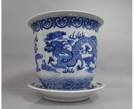 A Large Chinese Blue and White Planter and Stand, Decorated with Dragons and Phoenix, Total Height 35.5cms Diameter 
