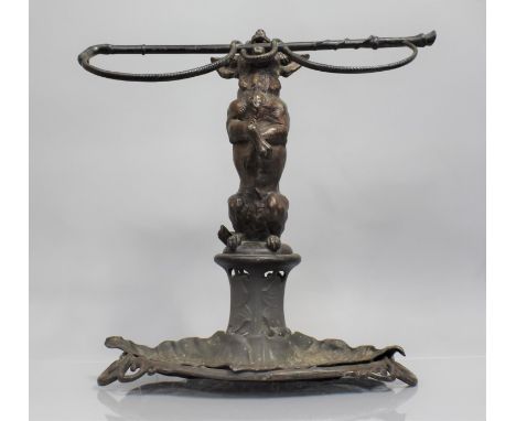 A Victorian Coalbrookdale Cast Iron Stick Stand in the Form of Begging Dog with Whip in Mouth, Drip Pan of Leaf Form having D