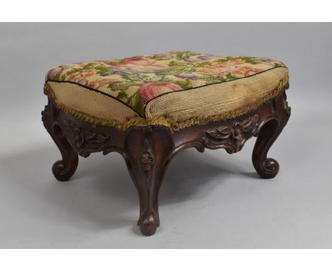 A 19th Century Walnut Stool with a Tapestry Seat over Carved Rails and Cabriole Legs, 30x36x22cms High 