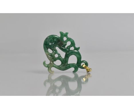 A Chinese Carved Jade Pendant with 14ct Gold Mount, 5cms High 