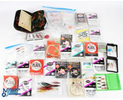 A quantity of fish fishing accessories, most of it looking unused, to include wet and dry fly cast in retail packets, tapered