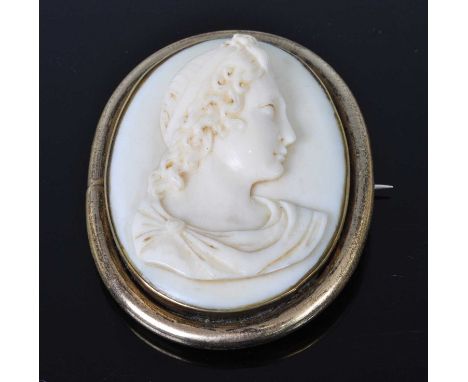 A 19th century ivory portrait miniature carved in high relief with profile portrait of a maiden, 58 x 45mm, housed in gilt me