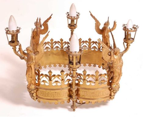 A 19th century Gothic cut brass and gilt metal four-light ceiling pendant, later fitted for electricity, the raised candle ar
