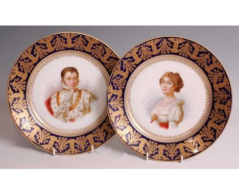 A pair of 19th century French porcelain portrait cabinet plates, the cobalt blue rims heavily gilt decorated with griffins, t