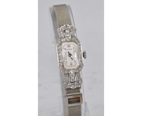 A lady's white metal and diamond 17-jewel manual wind Mappin cocktail watch, featuring an octagonal cream Arabic dial, with e