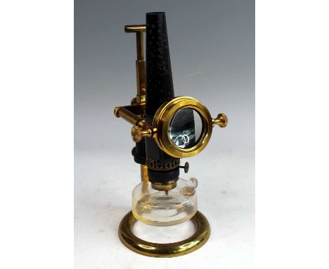 A late 19th century Watson &amp; Sons Ltd microscope oil lamp light source, having heavy brass base, glass oil reservoir with