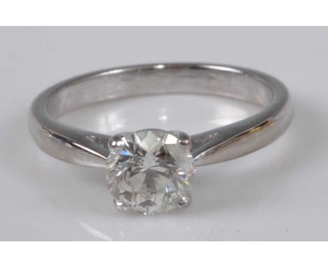 An 18ct white gold diamond solitaire ring, featuring a round brilliant cut diamond in a four-claw setting, diamond dimensions