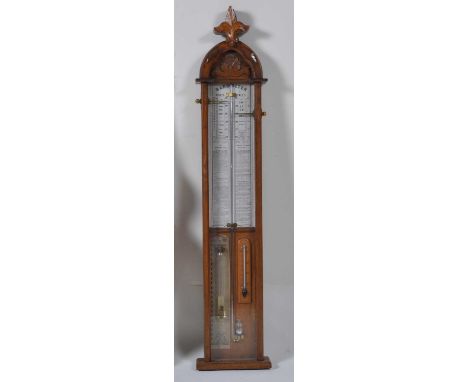 A Victorian oak Admiral Fitzroy's barometer, with paper scale, atmosphere tube, and thermometer dial, h.117cm
