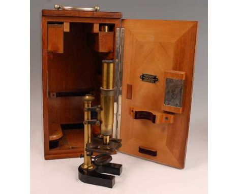 A small late 19th century Leitz brass students microscope, together with various accessories and in fitted case, the microsco