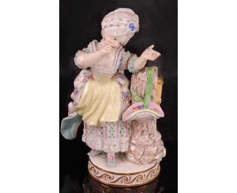 A 19th Century Meissen porcelain figurine of a Lady firing an Arrow, her bonnet containing arrows slung over the marble colum