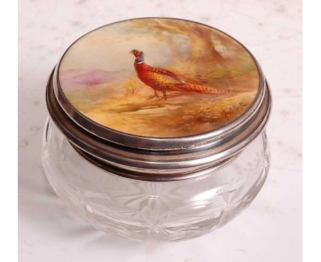 A porcelain topped cut glass powder bowl, the cover inset with a Royal Worcester plaque by James Stinton, finely painted with