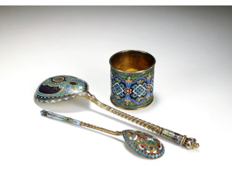 A Russian silver gilt and cloisonne enamel spoon, together with a further cloisonne enamelled spoon and a cloisonne enamel na