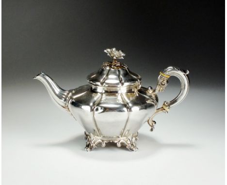 An early Victorian bachelors silver teapot, Edward, Edward junior, John & William Barnard, London 1842, with cast floral fini