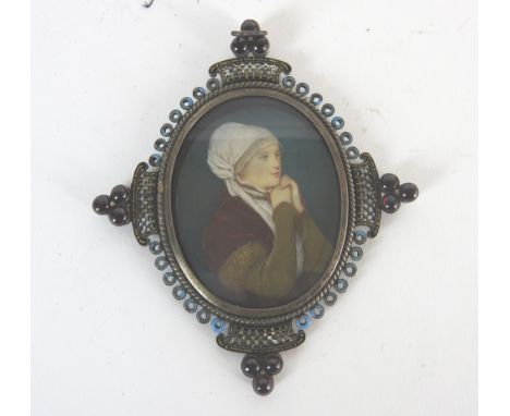 Continental school, late 19th centuryPortrait miniature of a lady in medieval costume, the elaborate white metal frame with b