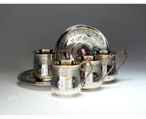 A set of four French silver cups and saucers, each cup engraved with bird and flower decoration and silver gilt interiors wit