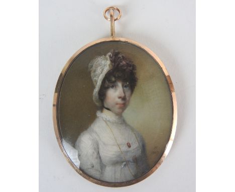Horace Hone ARA (Irish, circa 1756-1825)Portrait miniature of a lady wearing a white dress and lace bonnet with a long gold c