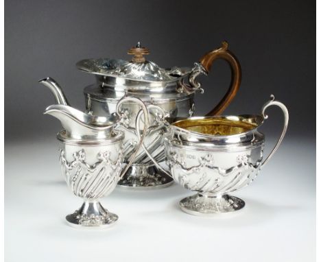 A Victorian three piece silver tea service, Johnson, Walker & Tolhurst Ltd, London 1896, each piece of circular form with emb