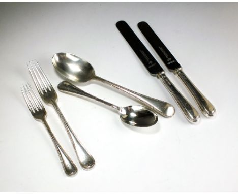 A set of silver bead pattern flatware, R.Smart & Sons, London 1903 & 1905, comprising; twelve table forks, twelve dessert for