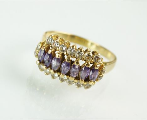 An amethyst and white stone cluster ring, the yellow metal shank stamped '18ct', ring size Q, weight 4.7g