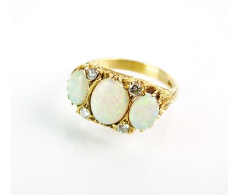 A Victorian style seven stone opal and diamond ring, designed as a row of three graduated oval cabochon opals interspersed wi