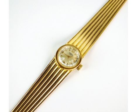 A Lady's Aureole bracelet watch, stamped '18k-O-750', the circular silvered dial with Arabic numerals and batons, manual wind