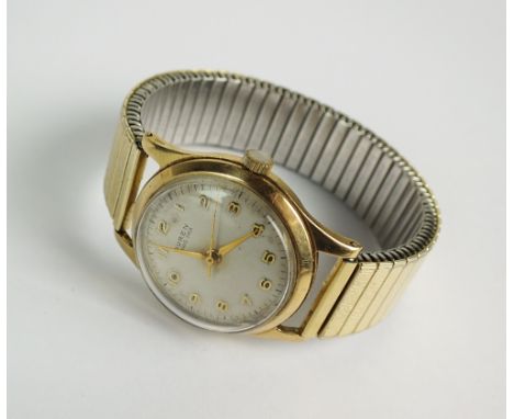 A 9ct gold Buren Grand Prix wristwatch, the circular silvered dial with Arabic numerals and sweep seconds hand, manual wind, 